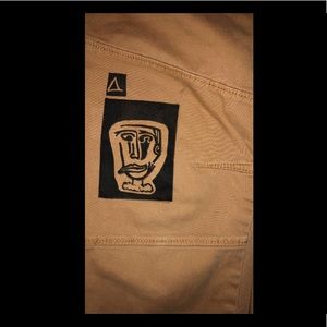 Hand printed/ hand carved, jogger pants with face print.